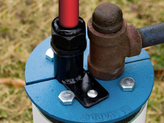 The EarthStraw Mounting Bracket is shown here mounted to a cast iron split well seal. It connects to any flat surface with a 7/8" diameter (or larger) opening for EarthStraw (which may be drilled). It comes with a drill and hammer-rivets for securing to the surface but may also be attached with 1/4-20 nut and bolt.