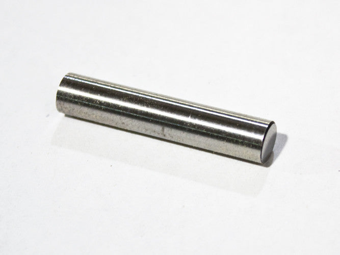 This hardened pin serves as an anvil for creating a flange (bead retainer) at the end of the stainless steel pump wire.